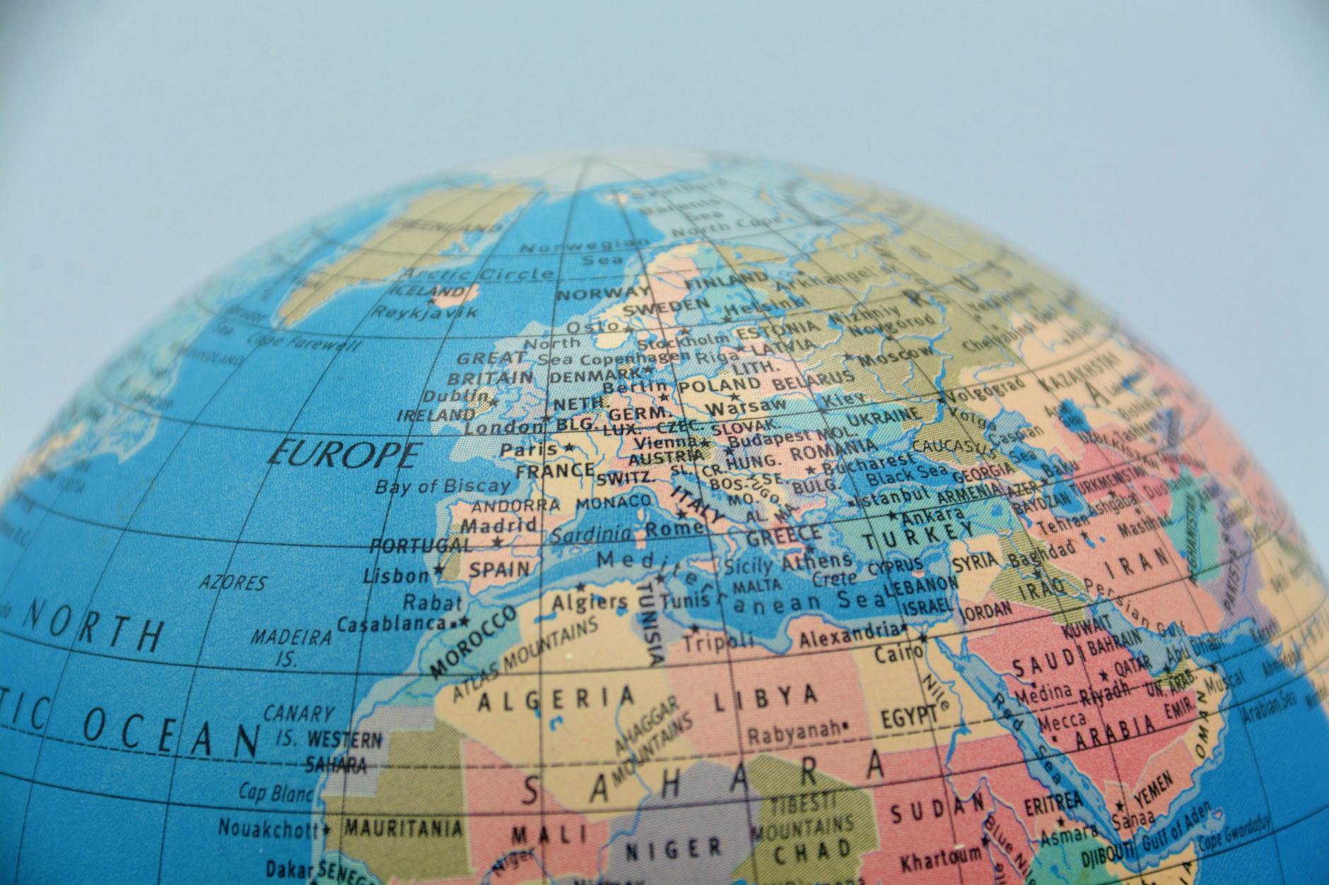 A close-up of a globe showcasing Europe, North Africa, and surrounding seas.
